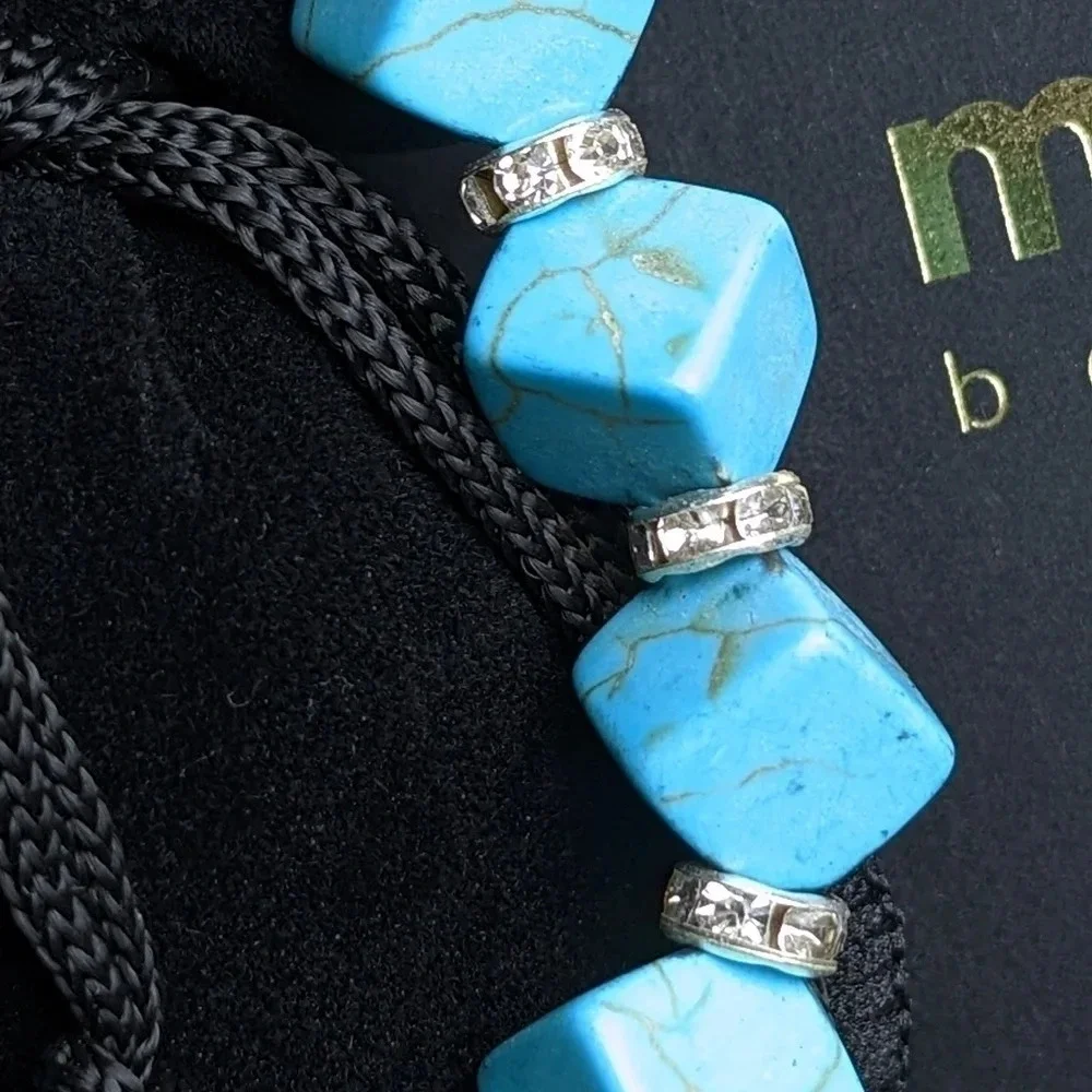 Pretty faux turquoise color beaded bracelet with CZ accents, cube shape beads